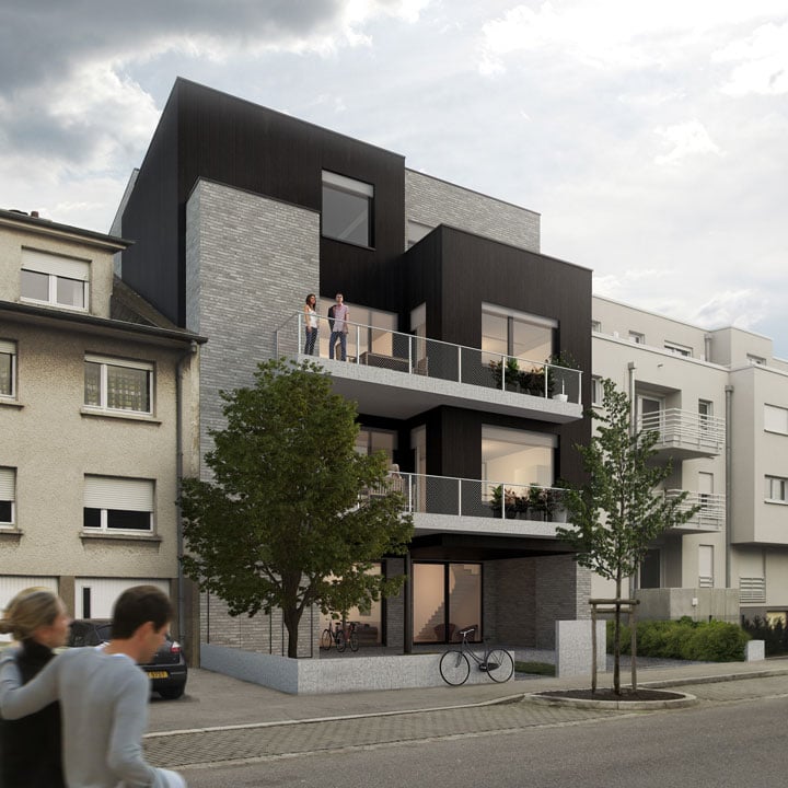 Bâtiment cohousing à Bonnevoie avec une façade ventilée en briques en bois brulé