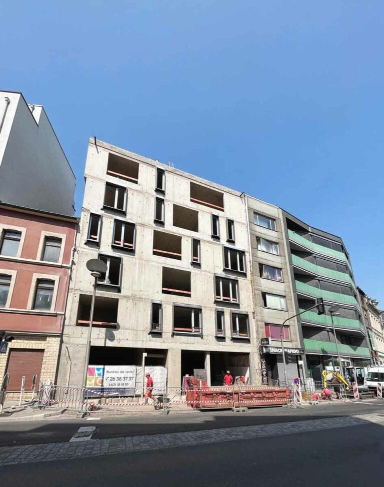 Building site boulevard Kennedy in Esch-sur-Alzette with glued tiles façade